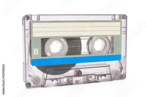 Used dust audio cassette on white background