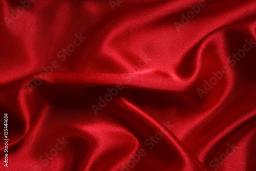 Red cloth waves background texture.