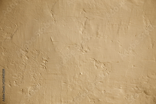 Grunge background beige wall whitewash lime plaster