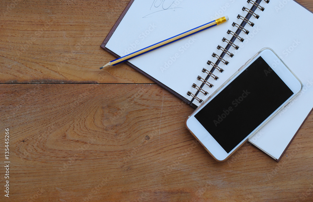 book and phone on wood background and wallpaper
book and phone on wood background and wallpaper