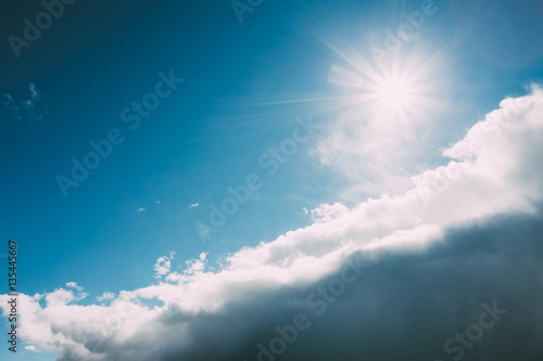 Dramatic Sky, Blue And White Colors. Sun Shine Over Fluffy Cloud