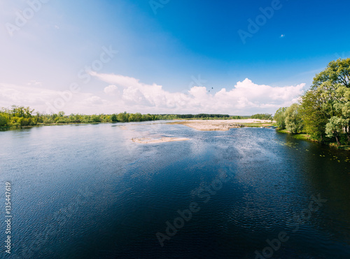 River Or Lake Landscape. Ripple Surface Of Calm Water At Sunny Day