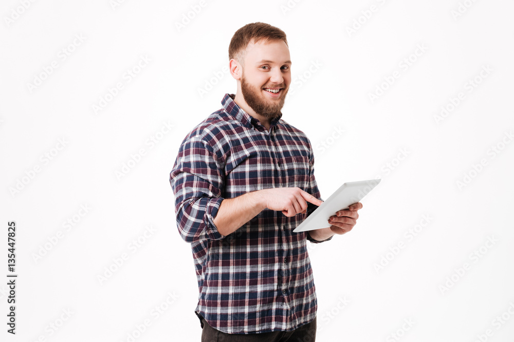 Man in shirt using tablet computer Man in shirt using tablet computer