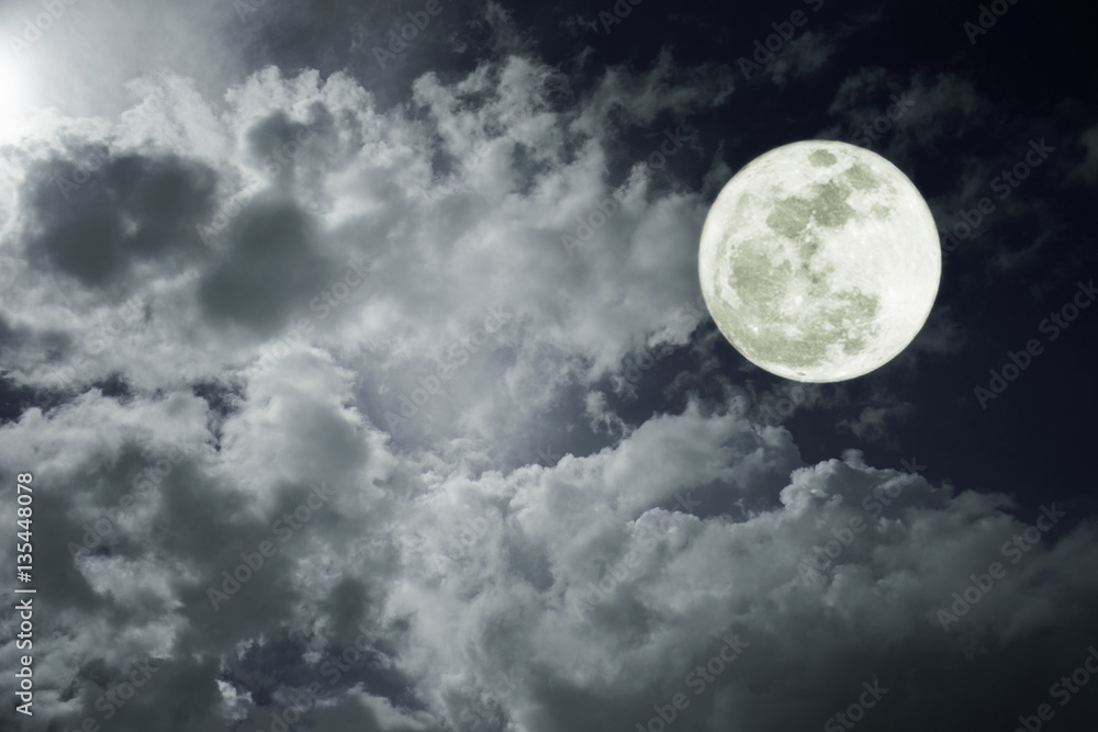Attractive photo of a nighttime sky with clouds, bright full moon would make a great background. Nightly sky with large moon. Beautiful nature use as background. Outdoors. Attractive photo of a nighttime sky with clouds, bright full moon would make a great background. Nightly sky with large moon. Beautiful nature use as background. Outdoors.