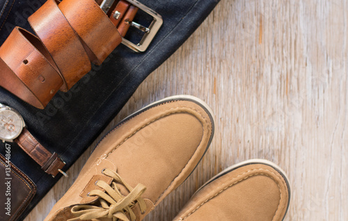 Close up vintage leather shoes man accessory. Men's casual outfits with accessories on rustic wood background.