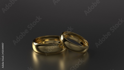 Couple of beauty gold wedding rings on black background. 3d rendering photo