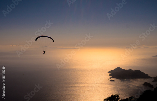 Paragliding towards sunset © Andrea
