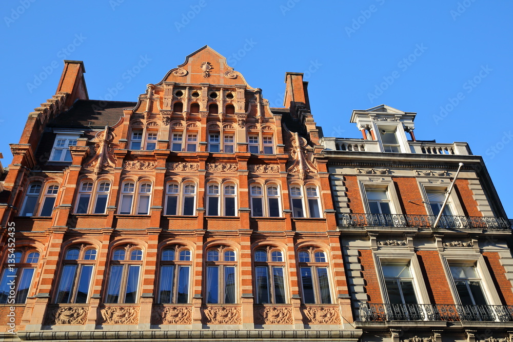 LONDON, UK: Red brick Victorian houses facades in the borough of Westminster