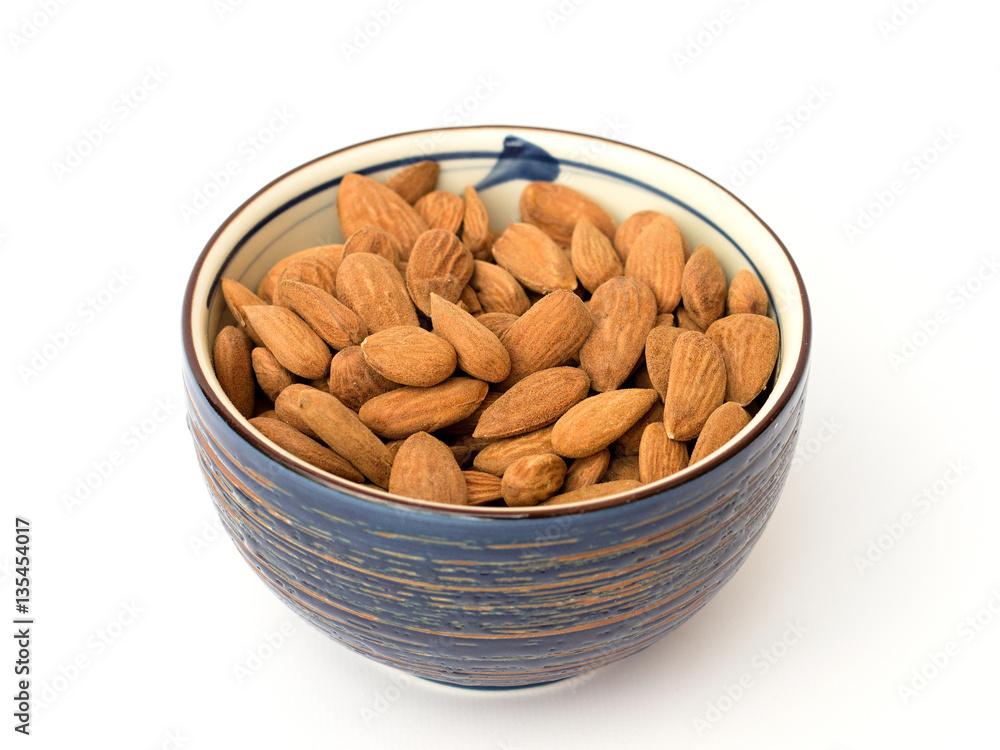 fresh almonds on a white background fresh almonds on a white background