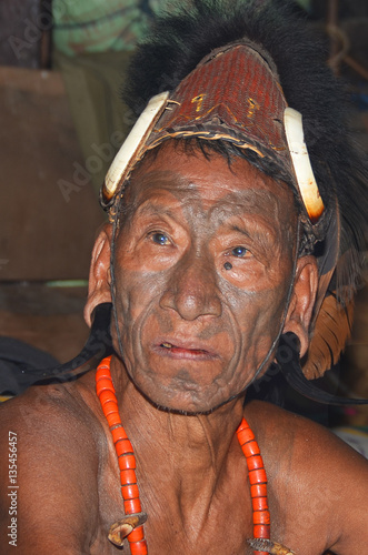 Portrait of the warrior from the tribe of Konyak headhunters in the Nagaland state, India
 photo