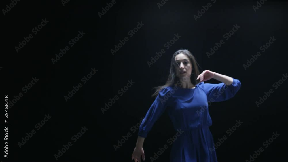 Young Woman Dancing and Swinging Her Hands Young Woman Dancing and Swinging Her Hands