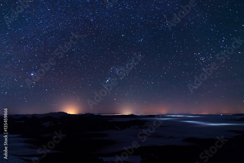 Night landscape with mountains, sky, stars