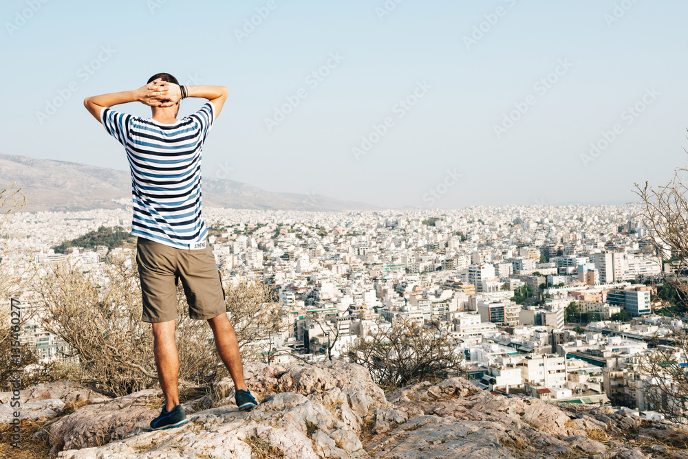 Greece, Athens, tourist looking at the city from Areopagus Greece, Athens, tourist looking at the city from Areopagus