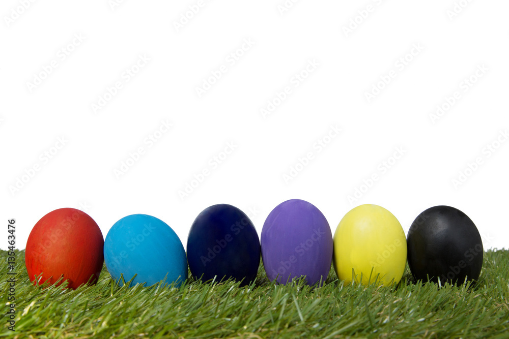 Colorful handmade easter eggs on green grass