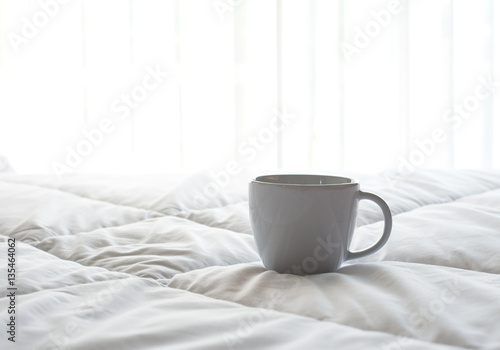 Fresh morning coffee on the bed.