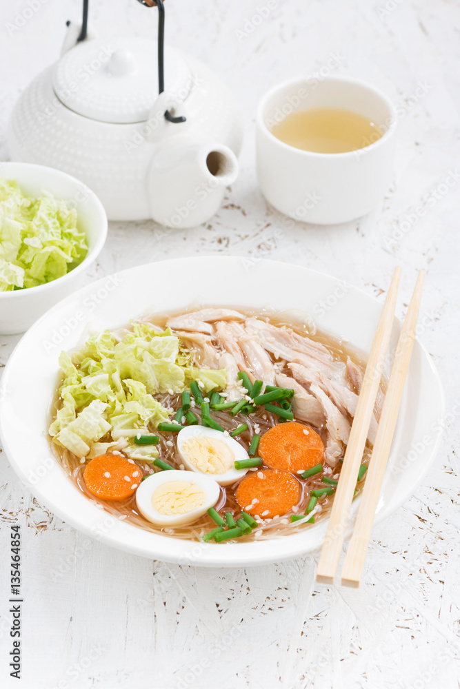 bowl of Chinese soup with glass noodles, vertical bowl of Chinese soup with glass noodles, vertical