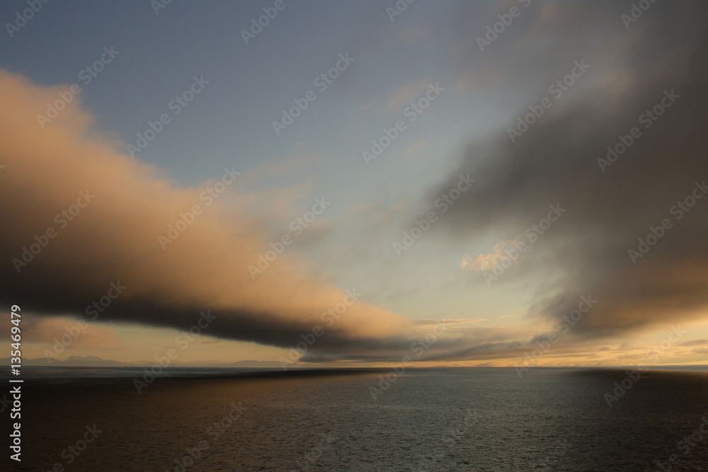 Low clouds over the sea at sunset