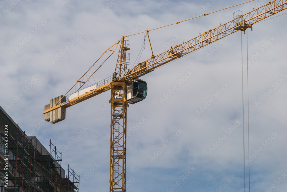 Crane operating near the building under construction