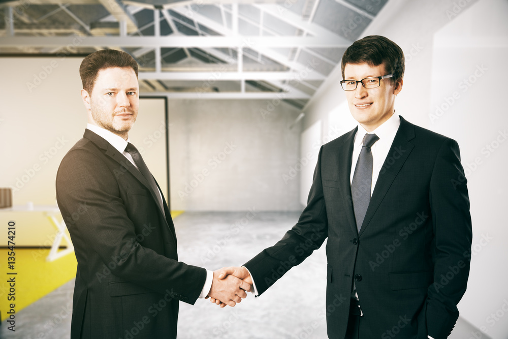 Cheerful businessman shaking hands Cheerful businessman shaking hands