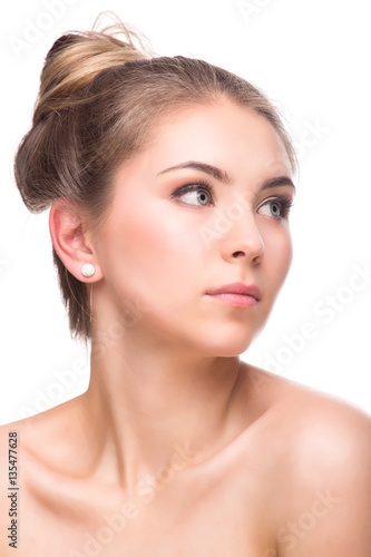 Beautiful Young Woman isolated on a White Background. Touching Her Face. Fresh Clean Skin.