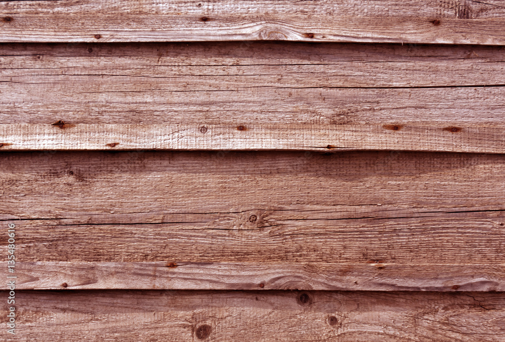 Obraz premium Red toned wooden wall surface.