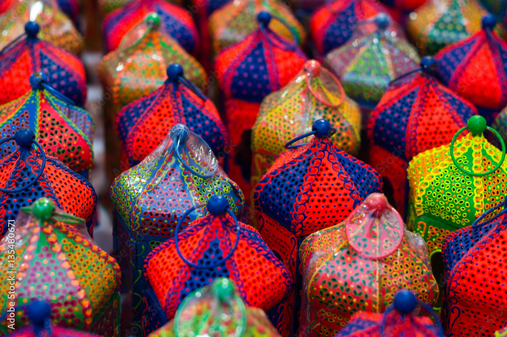 Colorful handicraft lanterns laid out together. Various designs and colors are available
