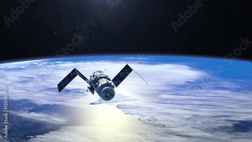 Satellite. The satellite is approaching. Solar panels are revealed. The tracking camera. 4K. 3D Animation. photo