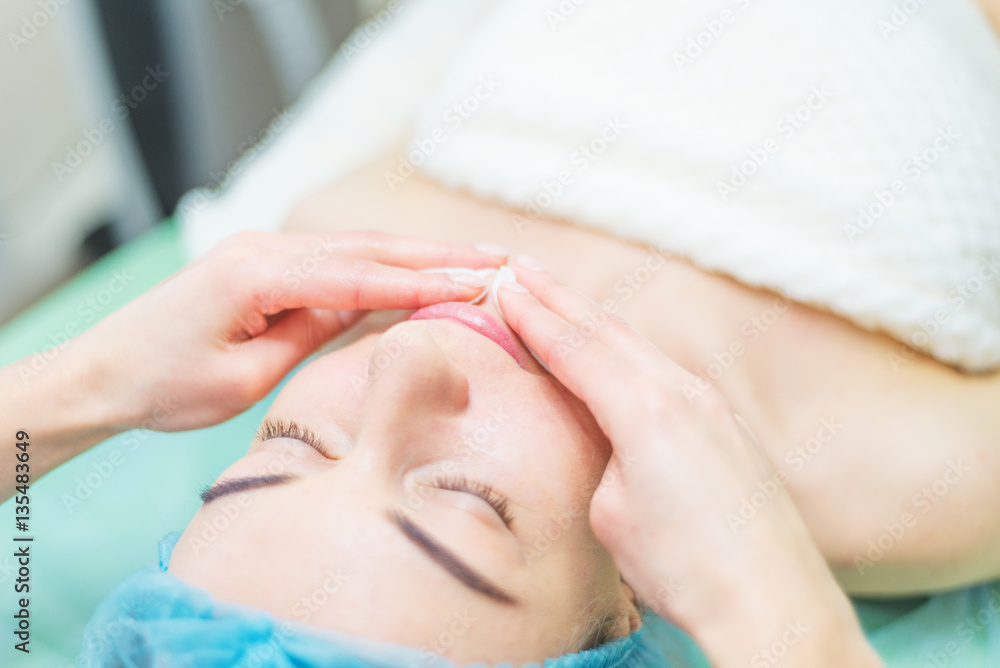 Woman receiving cleansing therapy Woman receiving cleansing therapy