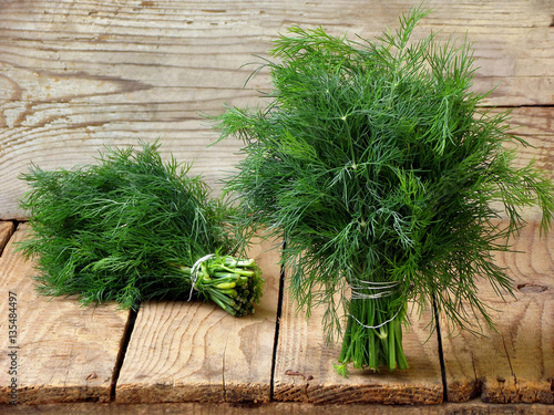 bunch of dill on wooden background Fototapet