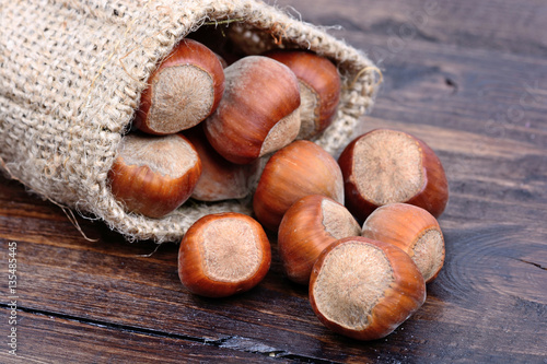 Hazelnuts in a sack on table