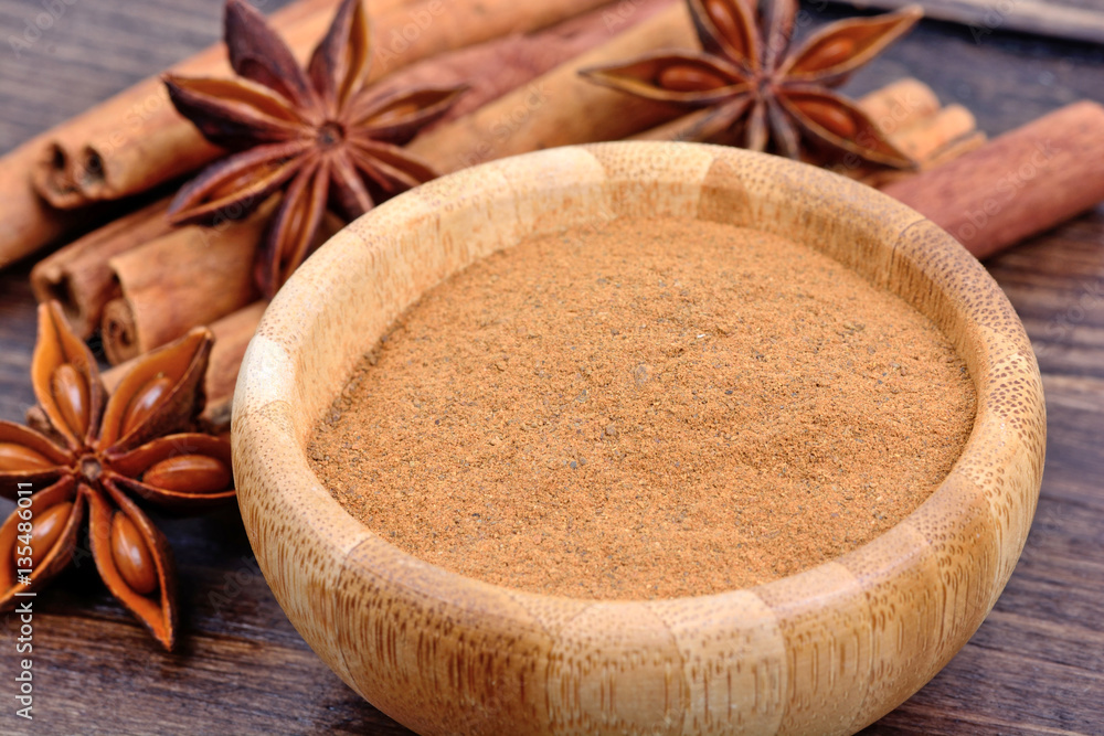 Bowl with cinnamon and star anise on table Bowl with cinnamon and star anise on table