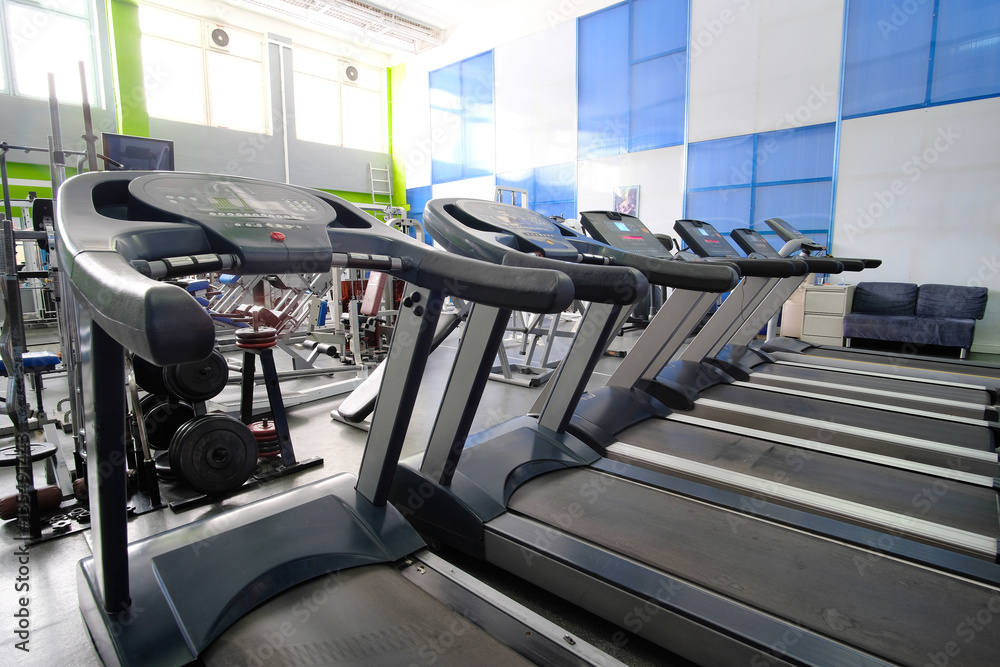 Fototapeta premium Interior of a fitness hall with treadmills