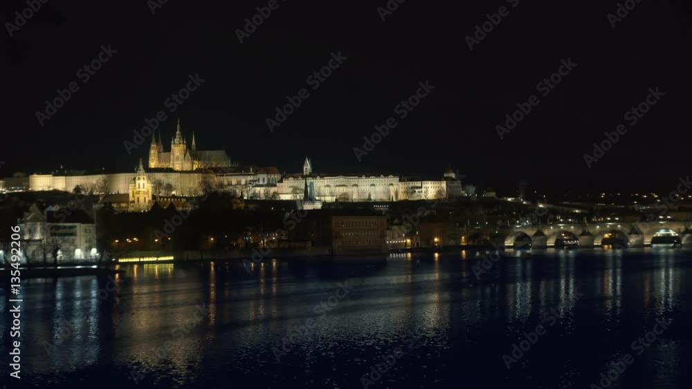 Prague, Czech Republic. Charles Bridge and Hradcany (Prague Castle) with St. Vitus Cathedral and St. George church evening dusk, Bohemia landmark in Praha. Prague, Czech Republic. Charles Bridge and Hradcany (Prague Castle) with St. Vitus Cathedral and St. George church evening dusk, Bohemia landmark in Praha.