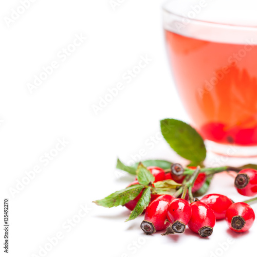 Fresh  tea with rosehip isolated on white