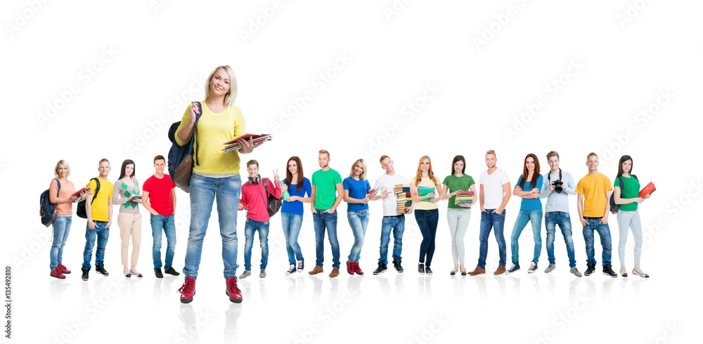 Fototapeta premium Large group of teenage students isolated on white background. Many different people standing together. School, education, college, university concept.