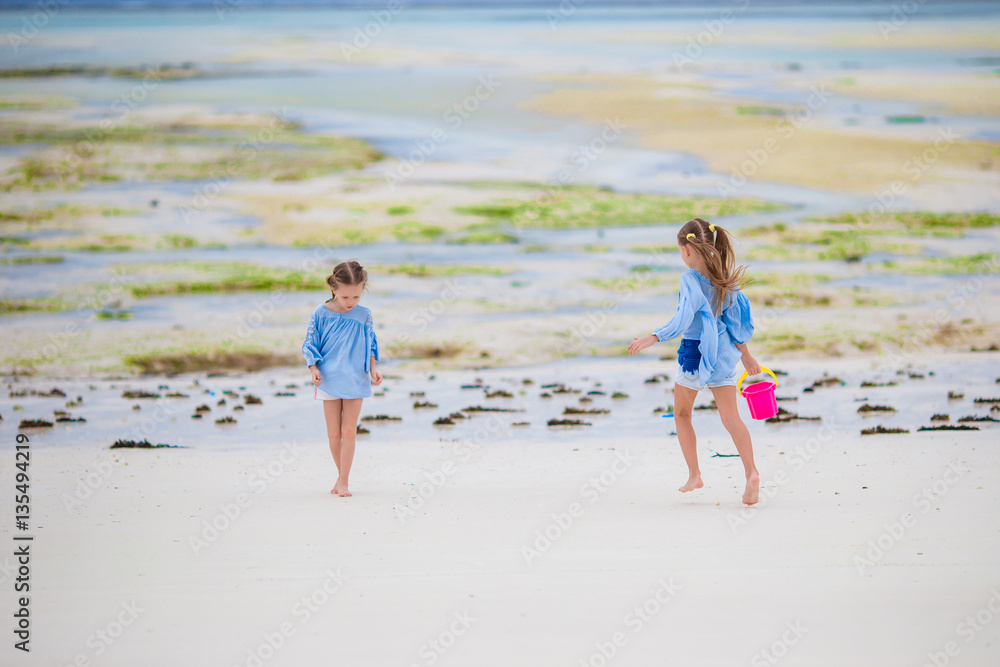 Adorable little girls at beach during summer vacation Adorable little girls at beach during summer vacation