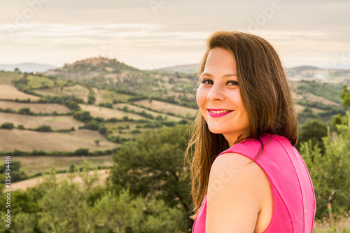 Girl in pink dress in Tuscan region Maremma, Italy