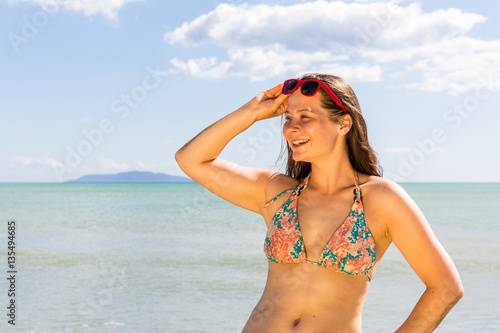 Girl at the natural beach Cala di Forno in Italy