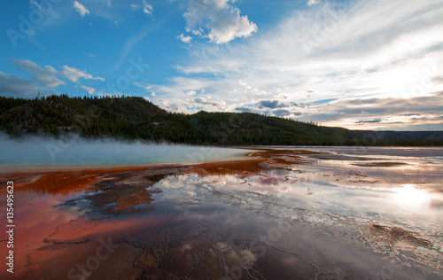 Grand Prismatic Spring under sunset clouds in Yellowstone National Park in Wyoming USA