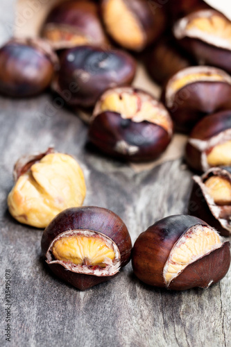 Roasted  chestnuts on wooden background