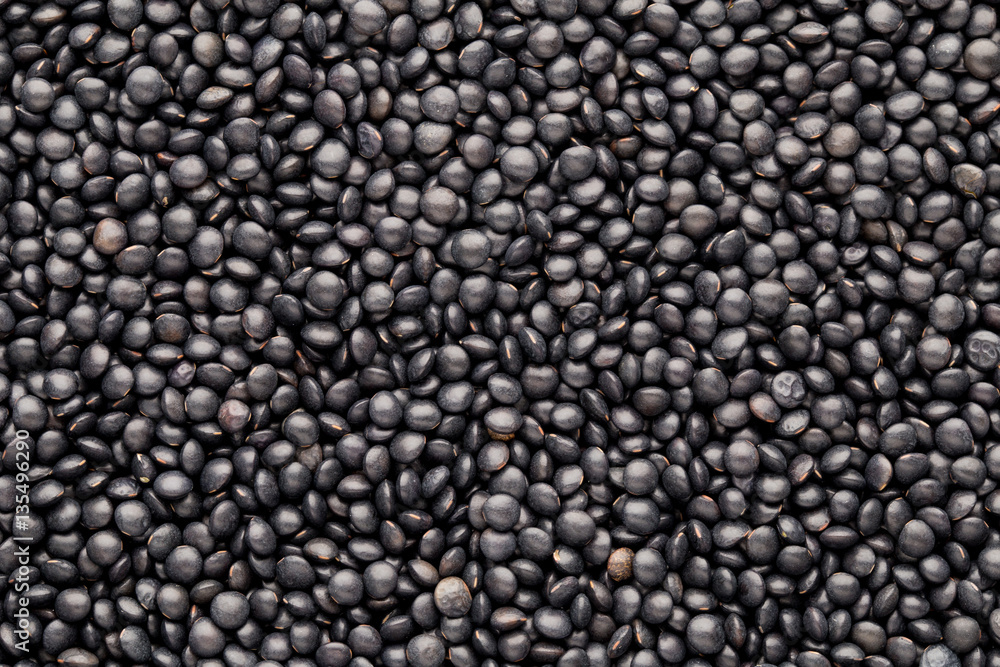 Food and cookery background of healthy dried black lentils. Food and cookery background of healthy dried black lentils.