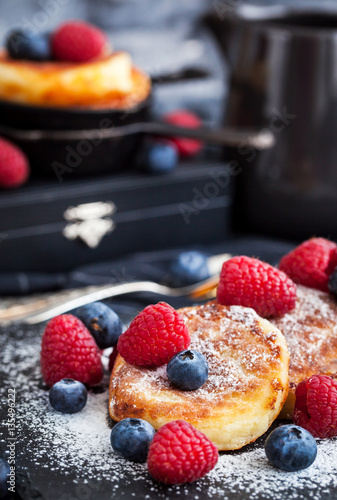 Cottage cheese pancakes decorated with fresh berries