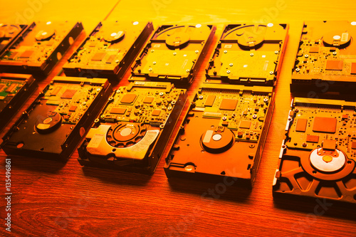 hard disk drives in a rows, warm orange tone