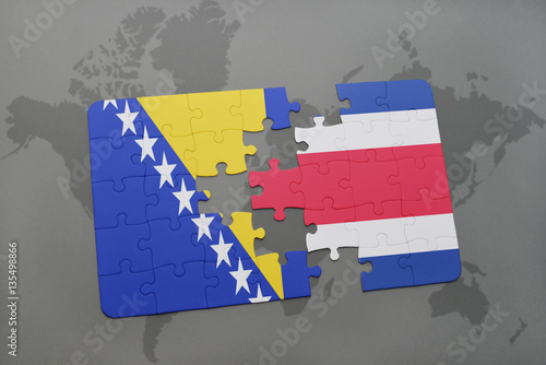 puzzle with the national flag of bosnia and herzegovina and costa rica on a world map photo