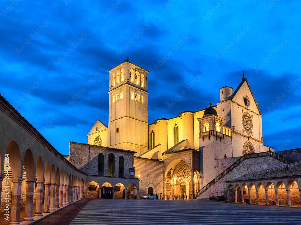 Famous Basilica of Saint Francis of Assisi with Lower Plazain night. Assisi, Umbria, Italy