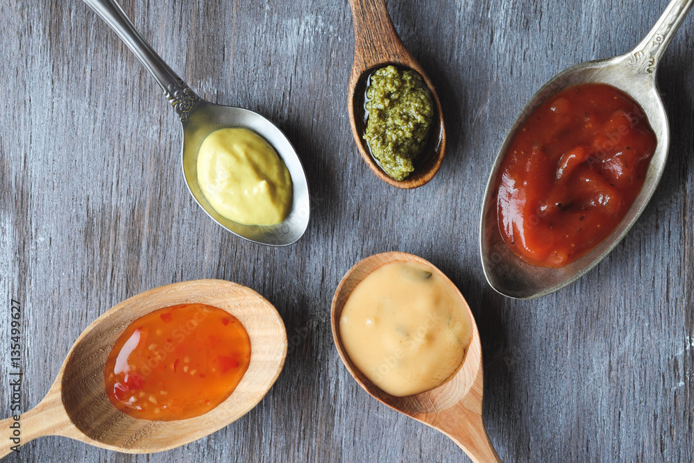 Different taste sauces in spoons top view Different taste sauces in spoons top view