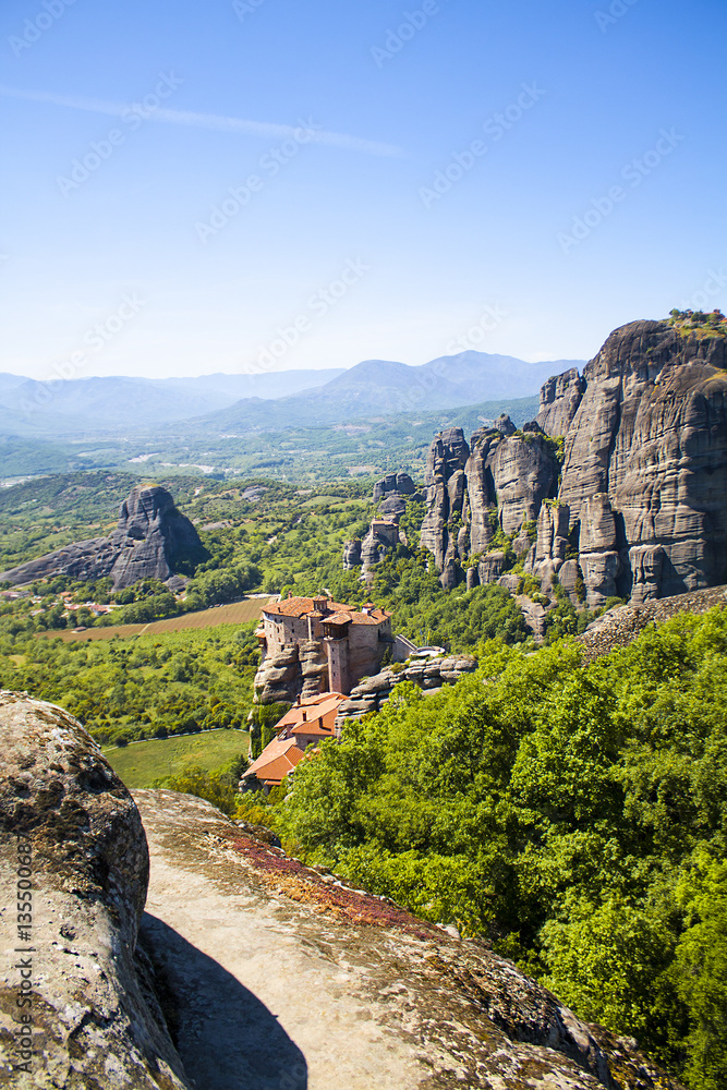 Meteora monasteries. Beautiful landscape and view on the Holy Monastery of Roussanov placed on the edge of high rock before sunset. Kastraki, Greece