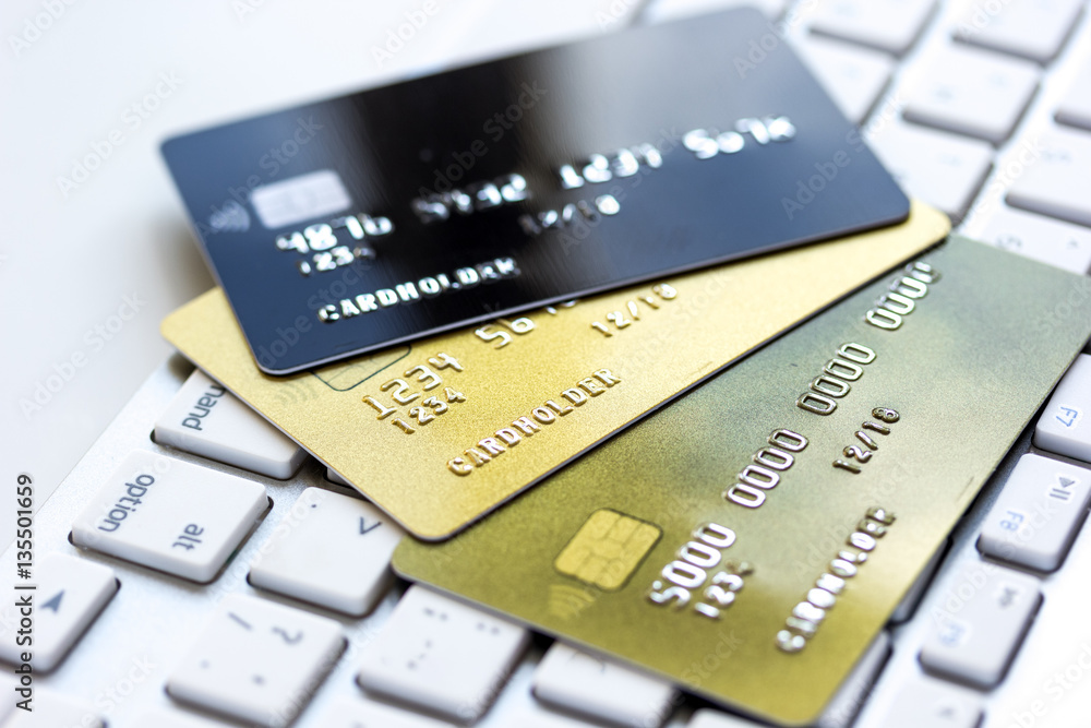 Credit cards on the keyboard close up Credit cards on the keyboard close up