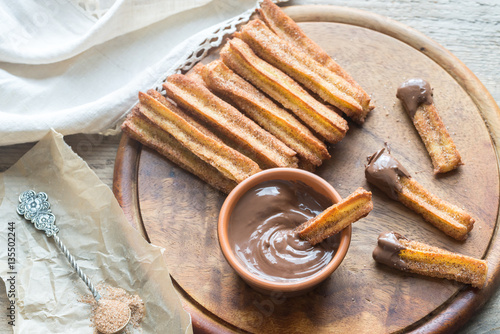 Churros - famous Spanish dessert with chocolate sauce