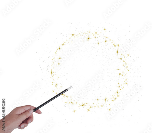 Fotografie, Obraz Magic wand in hand, circle or ring of golden stars and stardust isoated on white